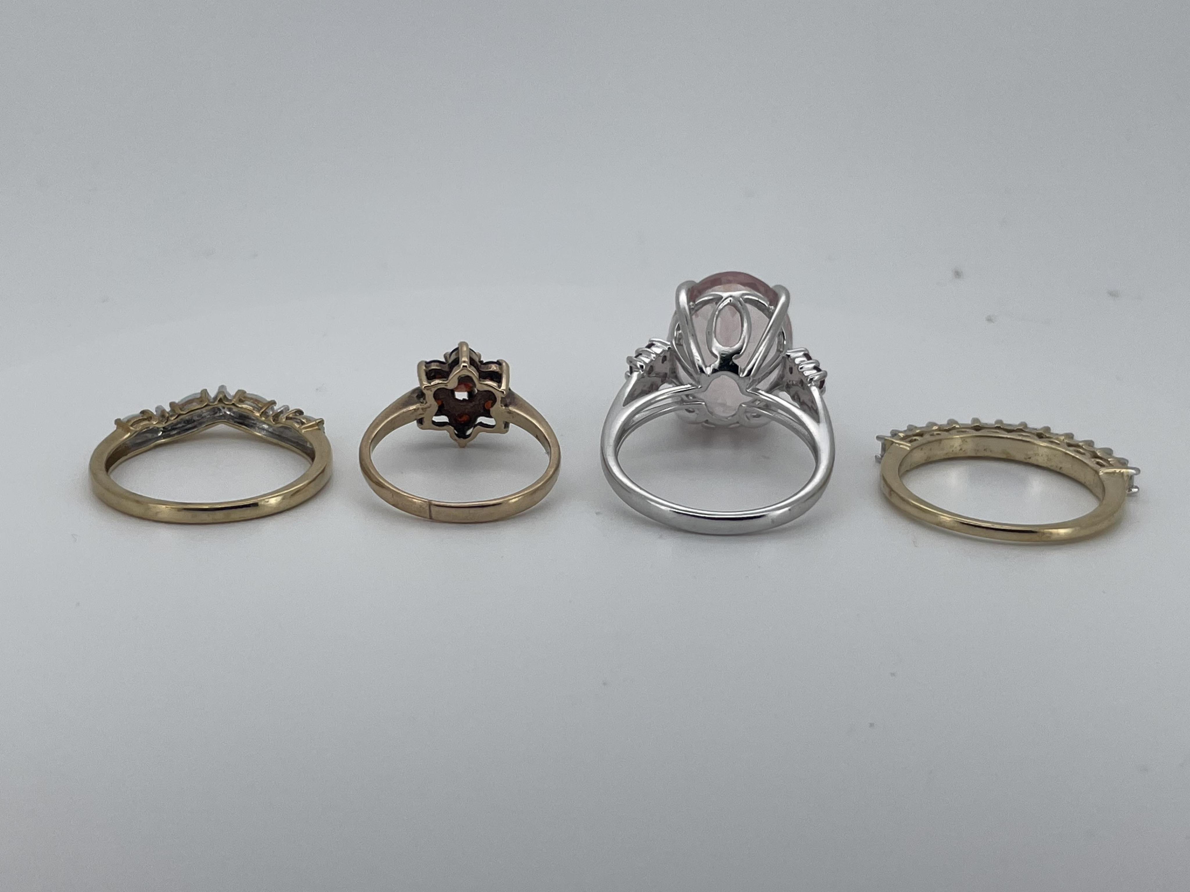 Four assorted modern 9ct and gem set rings, including thirteen stone diamond half hoop, size N/O, garnet cluster, size I, white opal and diamond chip, size O and white gold and morganite ring, size O, gross weight 12 gra